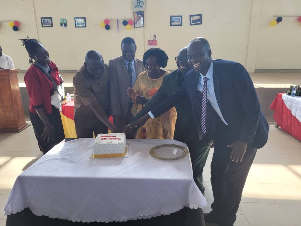 Staff sharing a cake moment